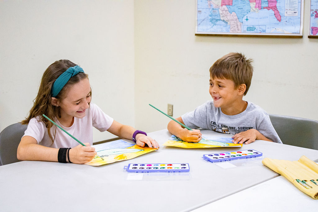 two-students-enjoying art-class