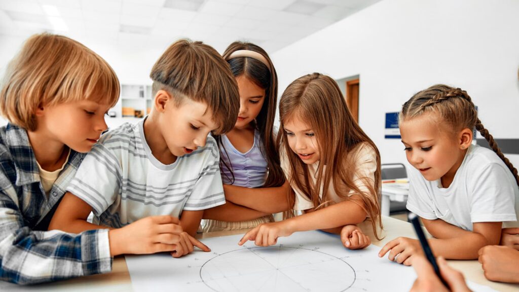 students-huddled-around-solving-a-math-problem-together